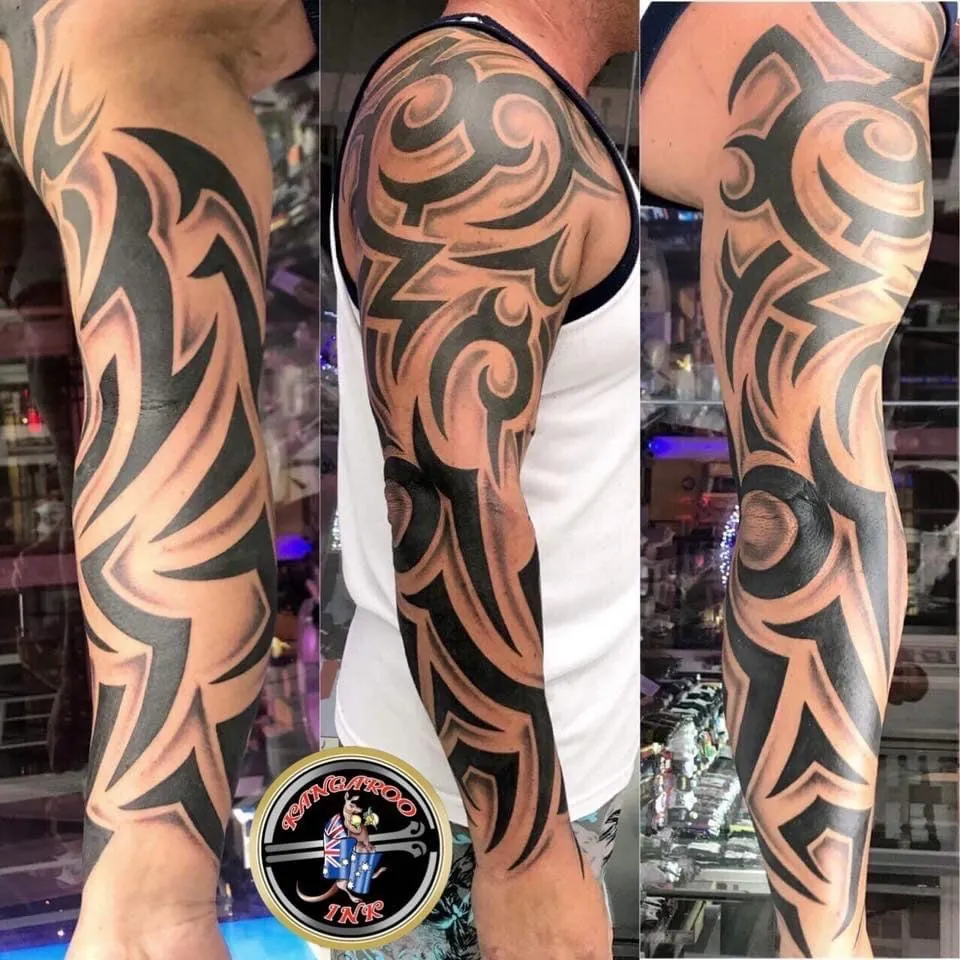 Bold tribal sleeve tattoo by Kangaroo Ink Patong